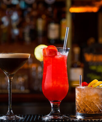 (47) Cocktails lined up on bar