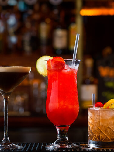 (47) Cocktails lined up on bar