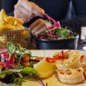 Eating prawns with a friend (2)