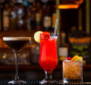 (47) Cocktails lined up on bar